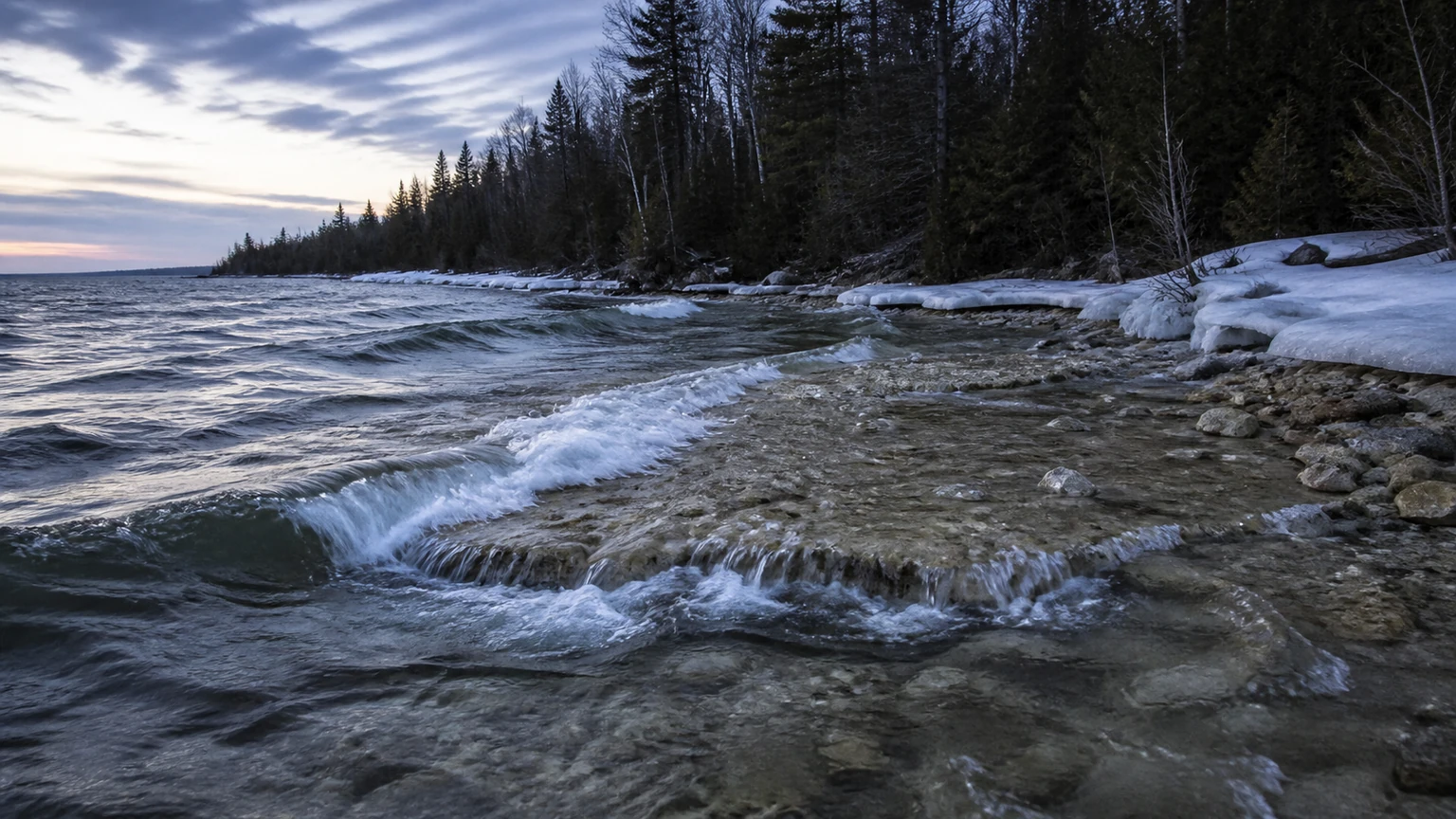 Waves breaking over a rubble shoreline just after ice-out — walleye spawning structure
